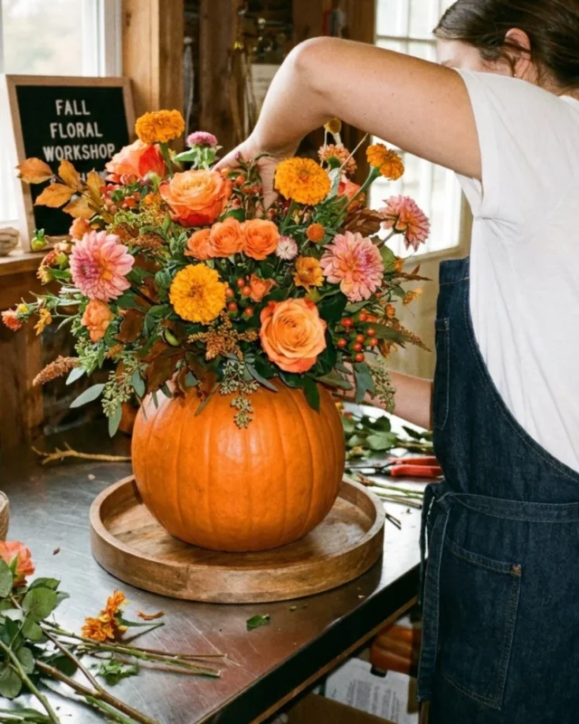 DIY pumpkin flower arrangement with seasonal flowers and vibrant colors