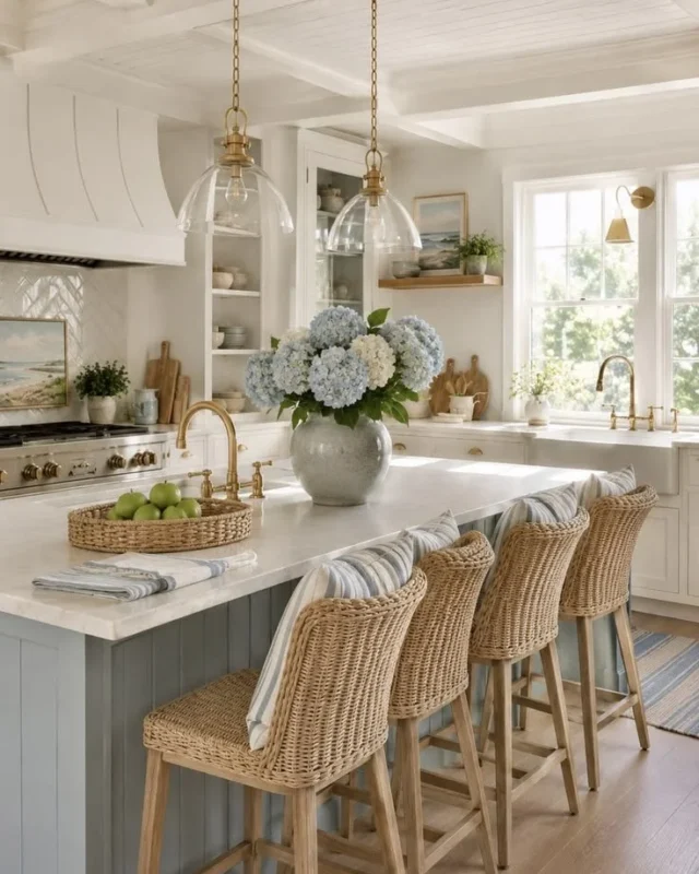 Nancy Meyers inspired coastal kitchen featuring blue and white design