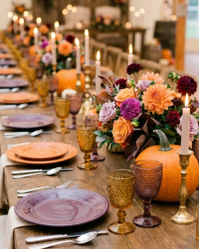 Bold purple fall centerpiece arrangement with seasonal decor elements