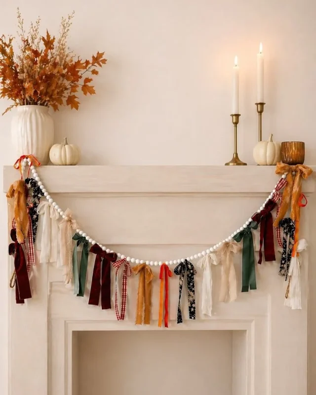Neutral velvet bow fall garland decor on a cozy mantel